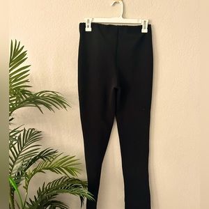 Black stretchy flare with open slit at the bottom.